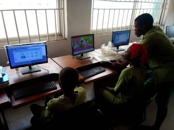 Teaching my classmates programming at a public school.